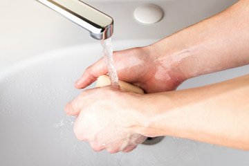 Wash hands with soap  to prevent for coronavirus  infection, hygiene to stop spreading coronavirus. Wet soapy hands