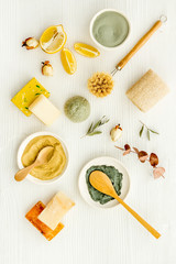Clay mask in bowl for facial spa on white background top view