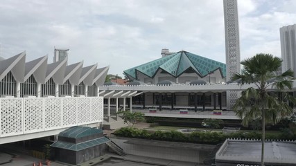 February 19th, 2020 - Kuala Lumpur, Malaysia : 4k Establishing b-roll aerial view of National Mosque. Malay Vernacular Architecture. Backward