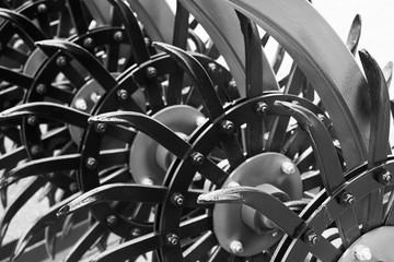 Modern cultivator for cultivating the land. Black and white image.