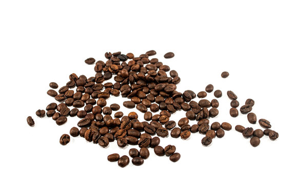 A roasted coffee beans texture background. Coffee beans. Distributed on a white background. © GuidePst