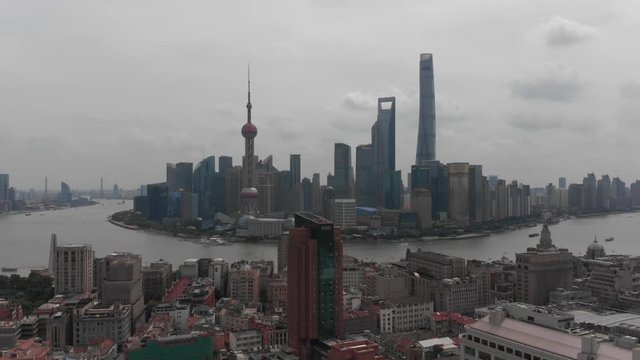 Aerial view over the impressive Lujiazui skyline from the Bund, across Huangpu River, Shanghai, China