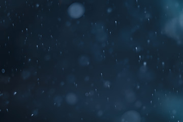 blue snowfall bokeh background, abstract snowflake background on blurred abstract blue