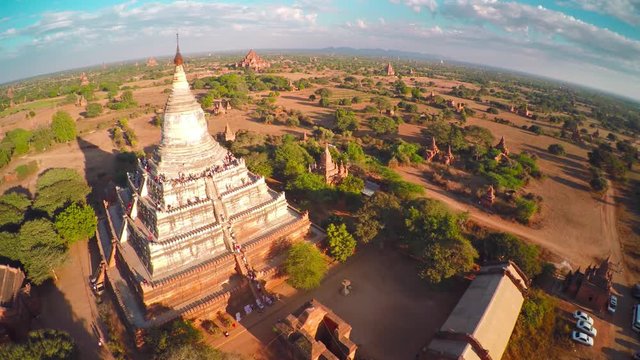 Flying over Shwesandaw Pagoda and Temples in Bagan at evening, Myanmar (Burma), 4k