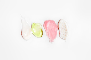 Swatch of cosmetics in stock: scrub, cosmetic gel, paraffin cream and cream