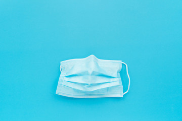 doctor mask on blue background, social distancing to prevent covid-19 spread campaign