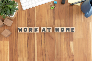 Work at home, Cubes wooden Lined up into text on the wood desktop vintage white office supplies.