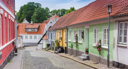 Fototapeta na wymiar Panorama of a street with little colorful houses in Haderslev, Denmark