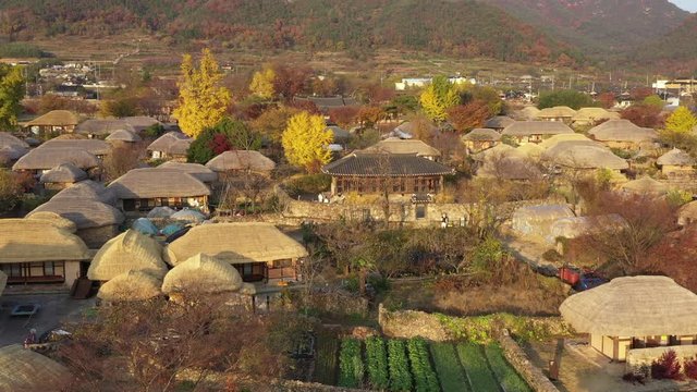 Aerial orbit with traditional korean village and historic fortress Naganeupsong, South Korea