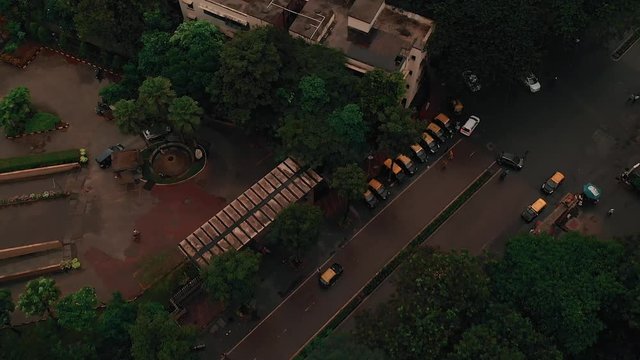 Aerial, tilt-up, drone shot, above traffic, in the city of Mumbai, on a sunny, summer day, in India