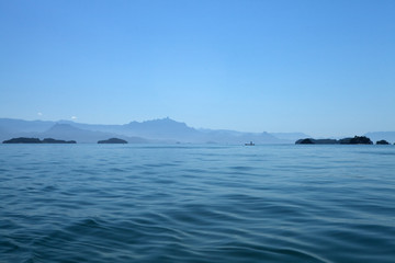 Plakat island in the sea, fisher, boat, crossing between islands, vacation, boat trip, fisherman, blue Paraty, Brazil 