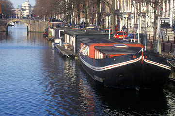 Fototapeta na wymiar Canal and houseboats in Amsterdam, Holland