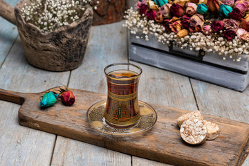 tea and cookie presentation on wooden floor