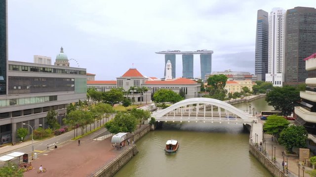 Reveal rising drone of Marina Bay Sands from Clarke Quay, Singapore.