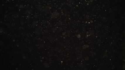 4k Natural Dust Organic Floating particles on black background. Dust in air atmosphere for your projects! Just drop it over your footage and use blending (screen) mode