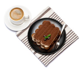 Classic tiramisu dessert on ceramic plate and cup of coffee isolated on white background with clipping path
