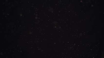 4k Natural Dust Organic Floating particles on black background. Dust in air atmosphere for your projects! Just drop it over your footage and use blending (screen) mode