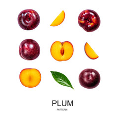 Red cherry plum pattern with green leaves isolated on white background.  Flat lay. Food concept..