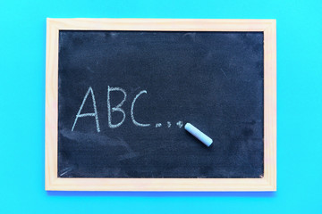 Blackboard texture chalk draw and write A B C for education in school chalkboard background Blackboard dark or chalkboard with horizontal and banner , selective focus