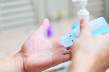 People using antibacterial sanitizer soap rub clean hand gel hygiene prevention of Covid-19 Coronavirus - Women washing hands with alcohol gel portable antibacterial sanitizer