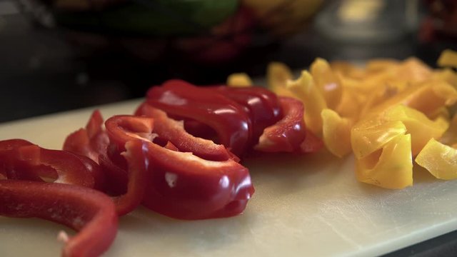 Close-up peppers vegetables on board, red and yellow pappers on board