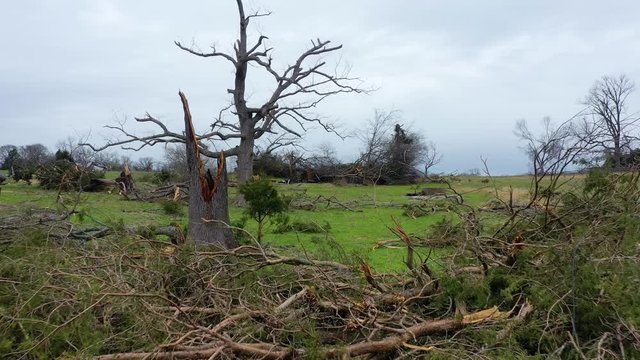 Aerial, Rising, Drone Shot Over A Fence, Ripped Up Trees Fields And Tornado Destruction, In Nashville, Tennessee, USA