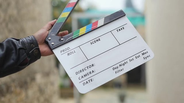 Blank Customizable Clapperboard Being Clapped With One Hand In Slow Motion