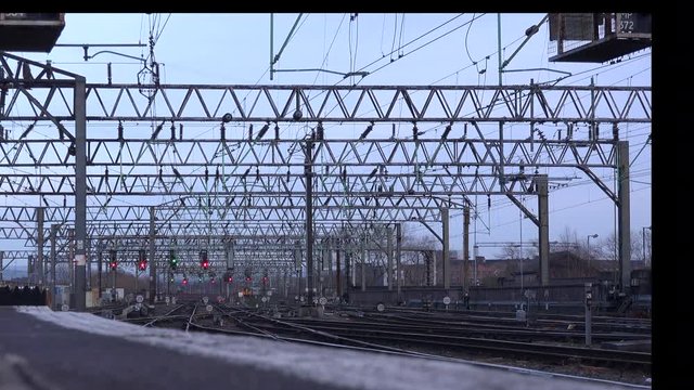 Time lapse of trains coming and going into Manchester station UK 4K