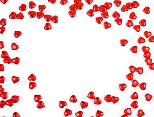 Frame made of red decorative hearts isolated on a white background. St. Valentine`s day concept. Text space.