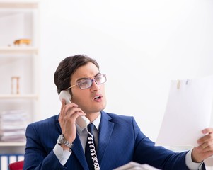 Busy man complaining about his workload