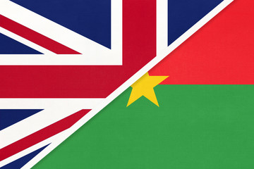 United Kingdom vs Burkina Faso national flag from textile. Relationship between two European and African countries.