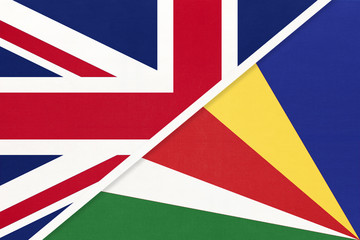 United Kingdom vs Seychelles national flag from textile. Relationship between two European and African countries.