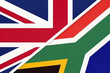 United Kingdom vs South Africa national flag from textile. Relationship between two European and African countries.