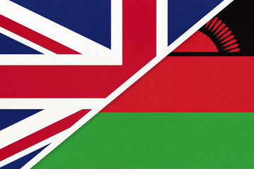 United Kingdom vs Malawi national flag from textile. Relationship between two European and African countries.