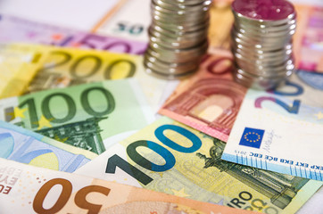 stacks of coins and euro banknotes .Business concept. Much money.