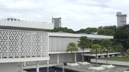 February 19th, 2020 - Kuala Lumpur, Malaysia : 4k Establishing b-roll aerial view of National Mosque. Malay Vernacular Architecture Facade. Push In Shot. 