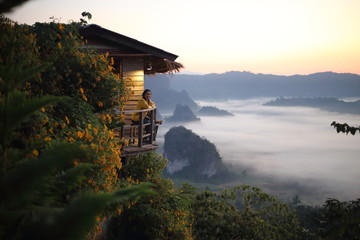 Women enjoy the view of Phu Lanka in the morning in Phayao, Thailand.