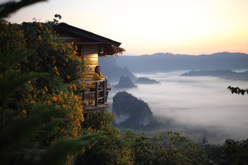 Women enjoy the view of Phu Lanka in the morning in Phayao, Thailand.
