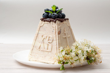 Marble Easter cake with engraving on a white background