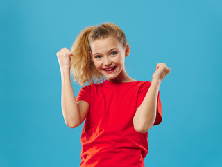 little girl showing thumbs up