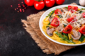 Spaghetti with mushrooms, cheese, spinach, rukkola and cherry tomatoes