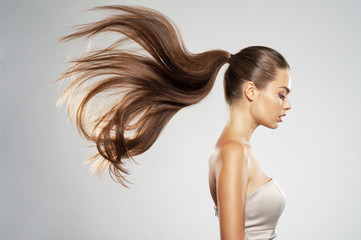 Profile portrait of a beautiful woman with a long straight  hair.