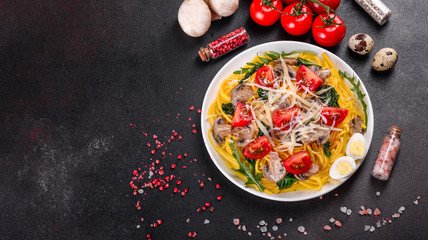 Spaghetti with mushrooms, cheese, spinach, rukkola and cherry tomatoes