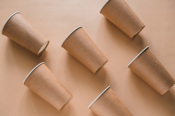 disposable paper biodegradable cups pattern on a beige background