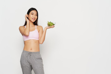 young woman holding a healthy salad