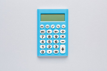 Modern calculator on grey background