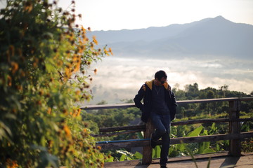 Men enjoy the view of Phu Lanka in the morning in Phayao, Thailand