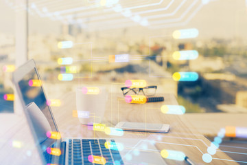 Double exposure of desktop computer and technology theme hologram. Concept of software development.