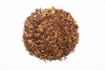 Dried red tea leaves isolated on white background