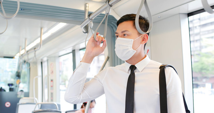 man with mask in metro